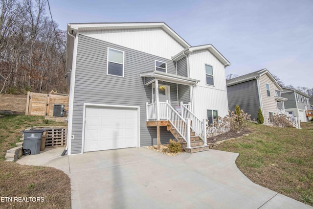 view of front of home with a front lawn and a garage