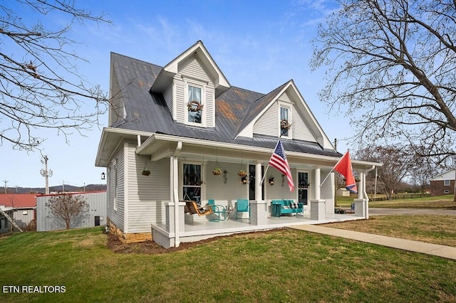 view of front facade featuring covered porch and a front lawn