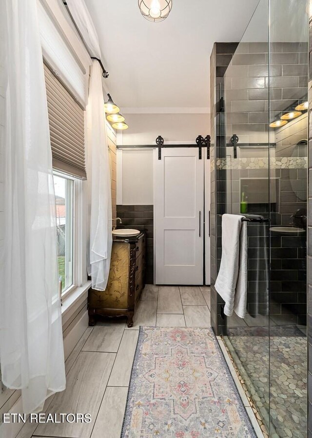 206 E Cedar Street 206E Cedar St E Cedar St, Livingston, TN 38570 - bathroom with vanity, a shower with door, tile patterned floors, ornamental molding, and tile walls
