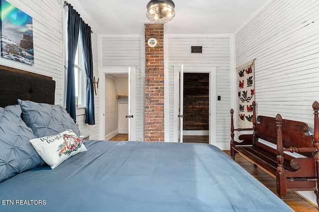 206 E Cedar Street 206E Cedar St E Cedar St, Livingston, TN 38570 - bedroom featuring wood-type flooring and brick wall