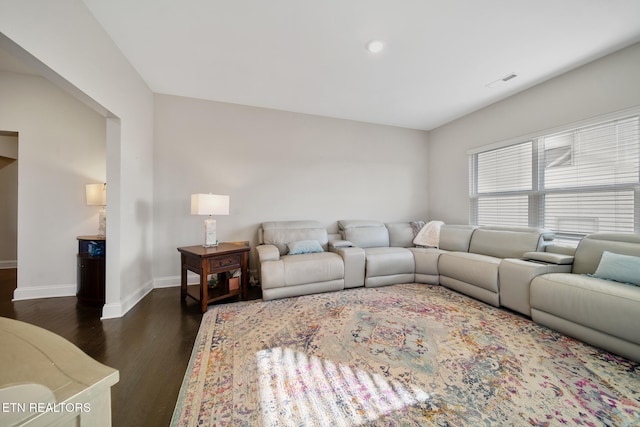 living room with dark hardwood / wood-style flooring