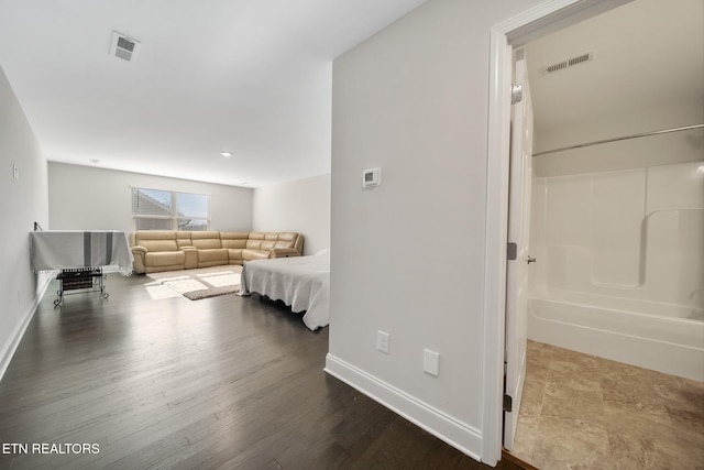 bedroom with hardwood / wood-style floors