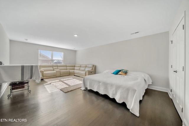 bedroom featuring dark hardwood / wood-style flooring