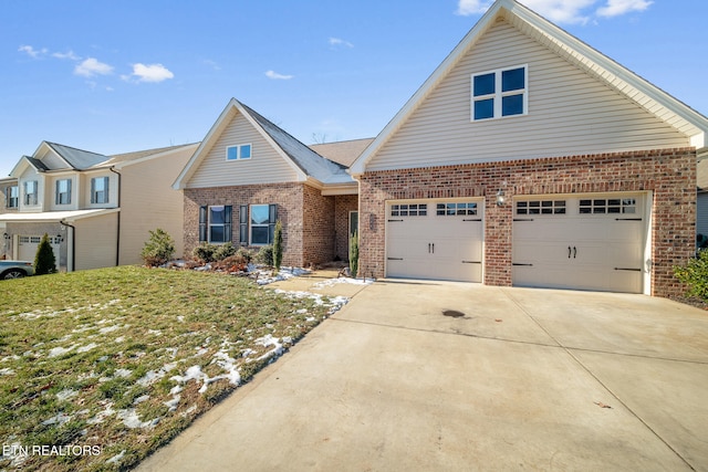 view of front of property featuring a front lawn and a garage