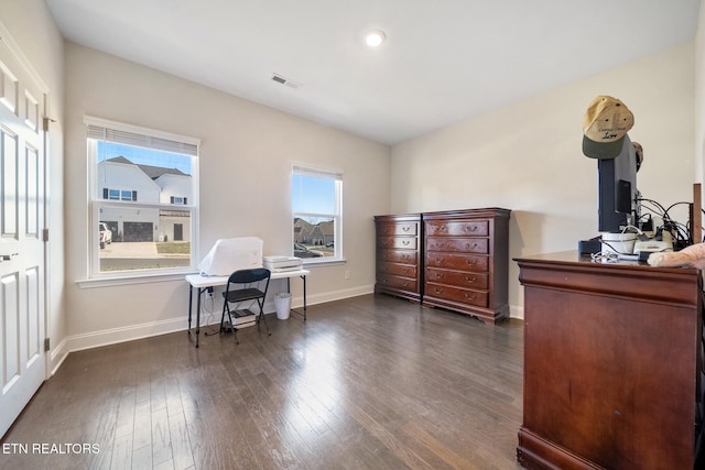 home office with dark hardwood / wood-style floors