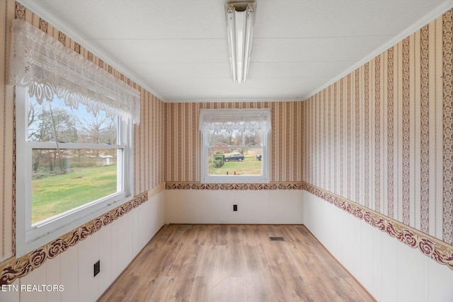 spare room featuring light hardwood / wood-style flooring