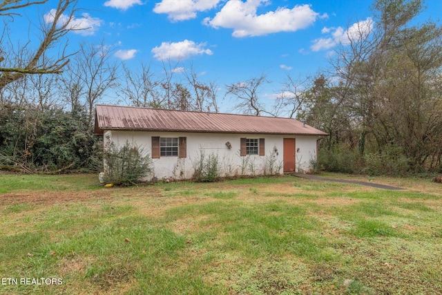 ranch-style house with a front lawn