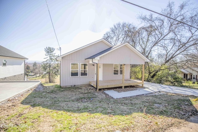 view of front of home featuring a porch and a wooden deck