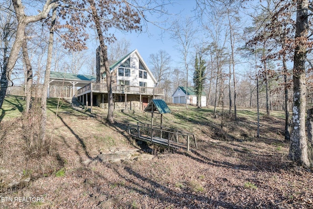 view of yard featuring a wooden deck