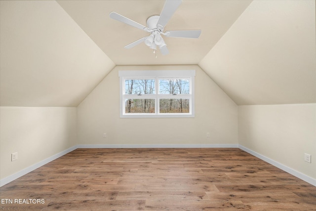 bonus room with hardwood / wood-style floors, ceiling fan, and lofted ceiling