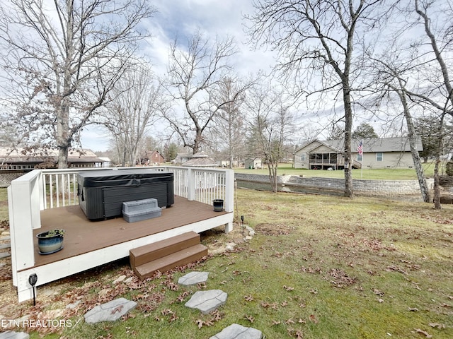 view of yard with a hot tub and a deck