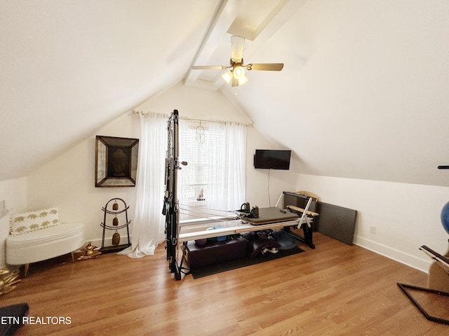 bedroom with ceiling fan, lofted ceiling, and light wood-type flooring