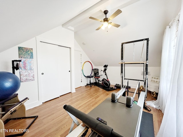 workout area with lofted ceiling, ceiling fan, and wood-type flooring