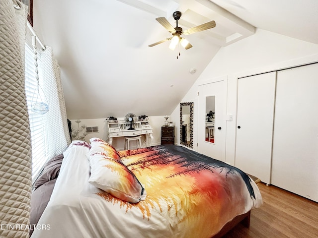 bedroom featuring a closet, lofted ceiling with beams, hardwood / wood-style flooring, and ceiling fan