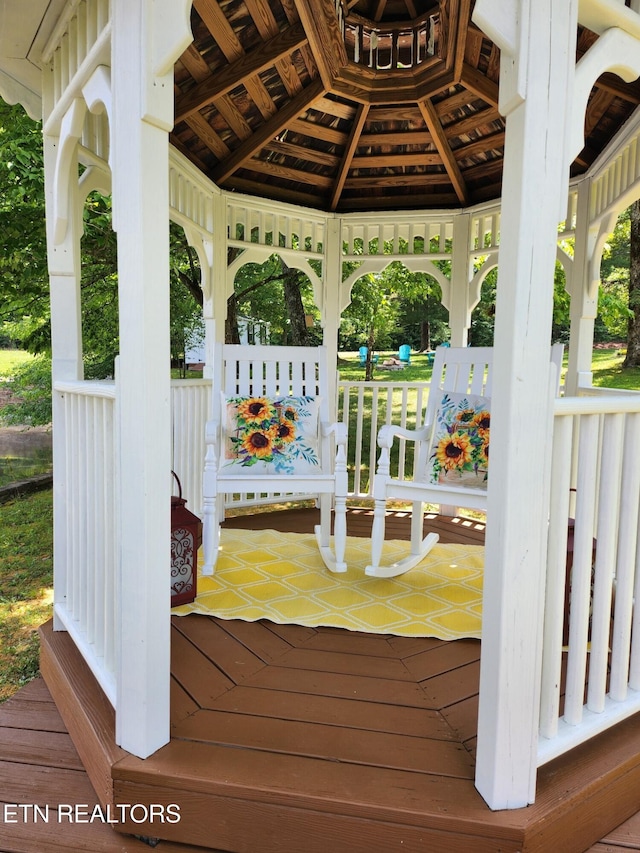 wooden terrace with a gazebo