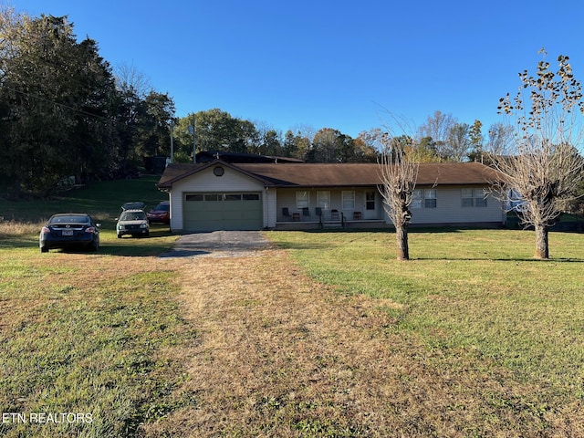 single story home with a front yard and a garage