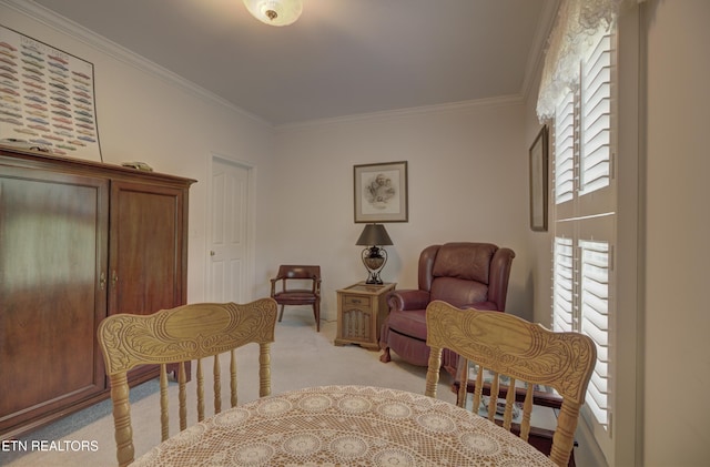 sitting room featuring light carpet and crown molding