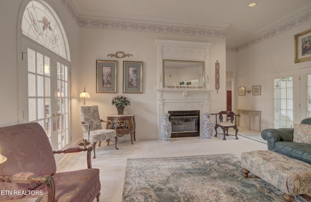 carpeted living room featuring french doors and crown molding