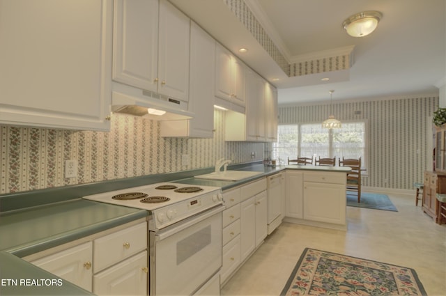 kitchen featuring kitchen peninsula, white appliances, crown molding, pendant lighting, and white cabinetry