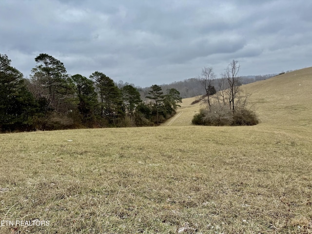 exterior space with a rural view