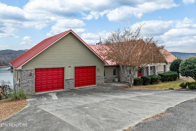 view of front of house with a mountain view and a garage