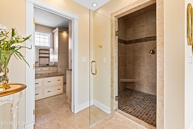 bathroom featuring a shower with shower door