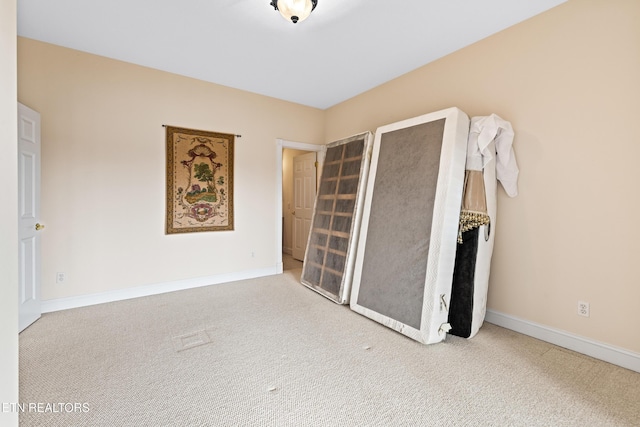 unfurnished bedroom with carpet