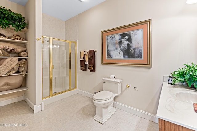 bathroom featuring tile patterned flooring, vanity, toilet, and a shower with shower door