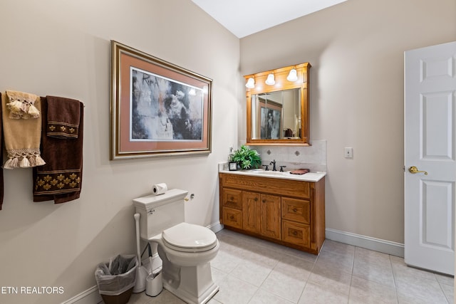 bathroom featuring tile patterned floors, tasteful backsplash, vanity, and toilet