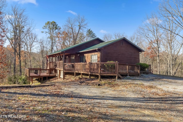 exterior space featuring a wooden deck