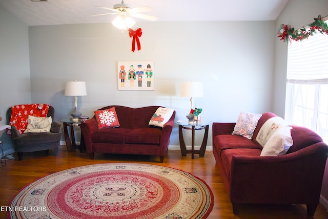 living room featuring ceiling fan and wood-type flooring