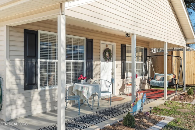 view of exterior entry featuring a porch