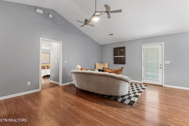 living room featuring ceiling fan, wood-type flooring, and high vaulted ceiling