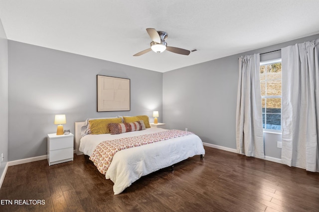 bedroom featuring ceiling fan and dark hardwood / wood-style flooring