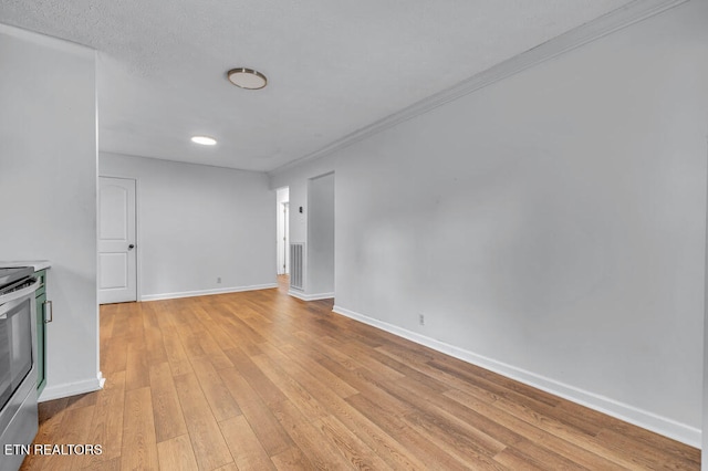 unfurnished living room featuring light hardwood / wood-style floors and crown molding