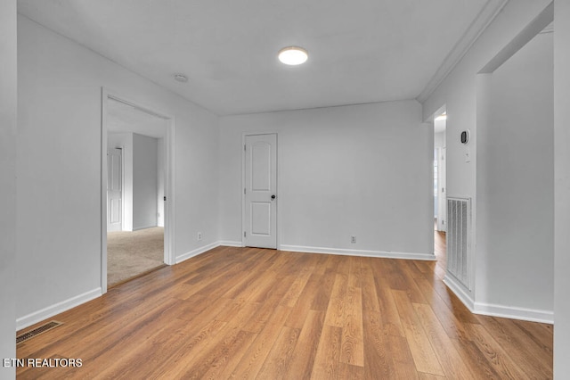 unfurnished room with light hardwood / wood-style floors