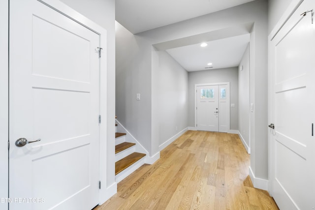 doorway to outside with light hardwood / wood-style flooring