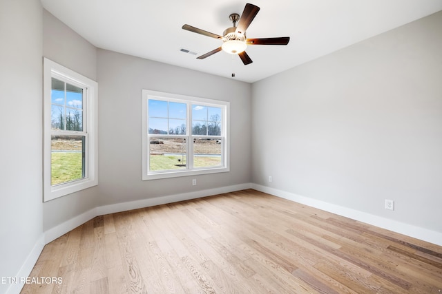 unfurnished room featuring ceiling fan and light hardwood / wood-style flooring