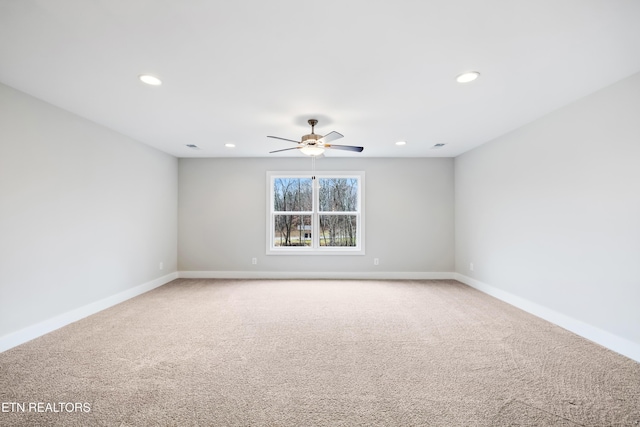 spare room with carpet flooring and ceiling fan