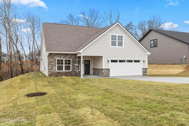 view of front property featuring a garage and a front lawn