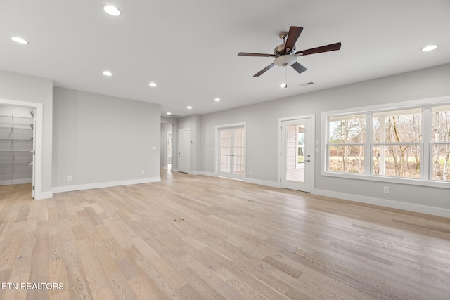 unfurnished living room with light hardwood / wood-style floors and ceiling fan