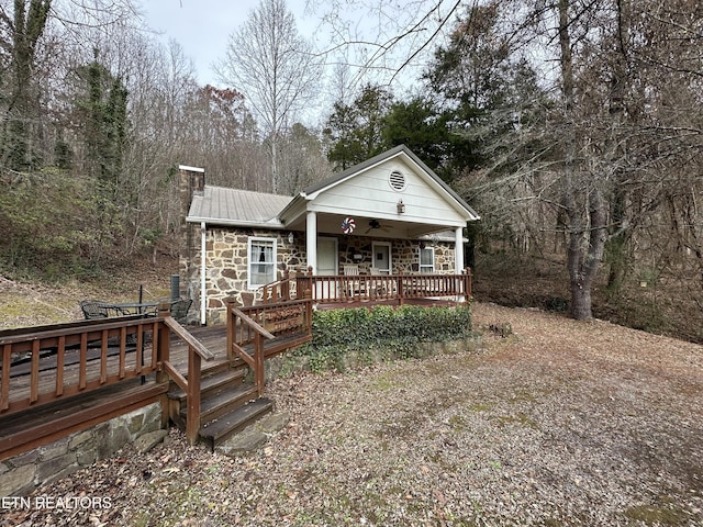 view of front of property with ceiling fan and a porch