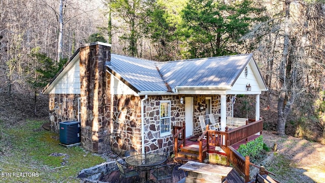 bungalow-style house with cooling unit