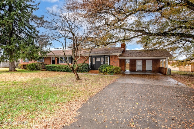 ranch-style house with a front lawn and a carport