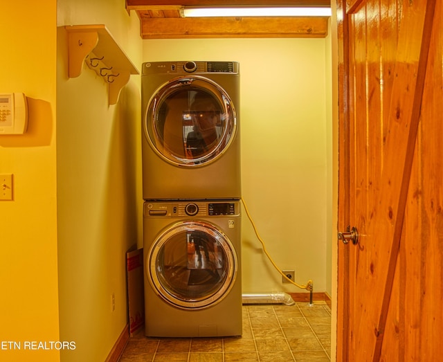 laundry area with stacked washing maching and dryer