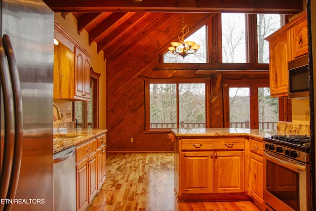 kitchen with wood ceiling, stainless steel appliances, light hardwood / wood-style flooring, a notable chandelier, and beamed ceiling