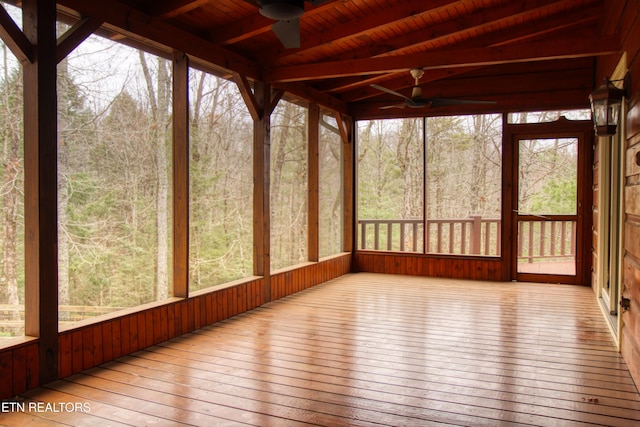 unfurnished sunroom featuring ceiling fan and wooden ceiling