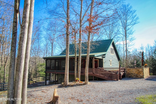 view of front of property with a sunroom