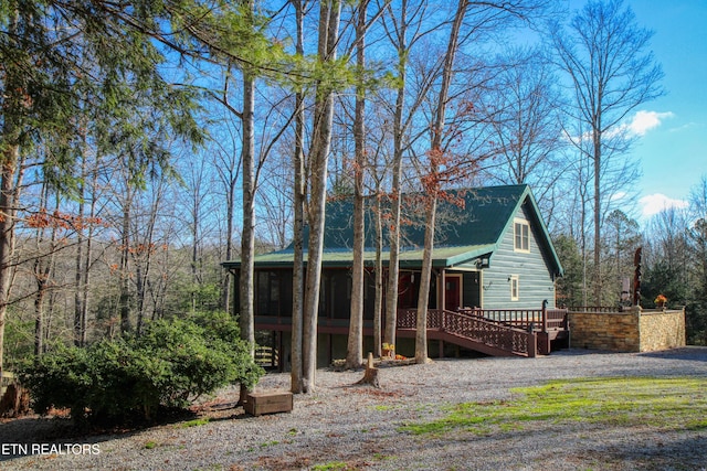 exterior space featuring a sunroom