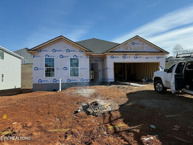 property in mid-construction featuring a garage